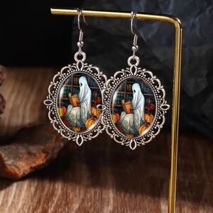 STAINLESS STEEL & SILVERY PLATED GHOST EARRING